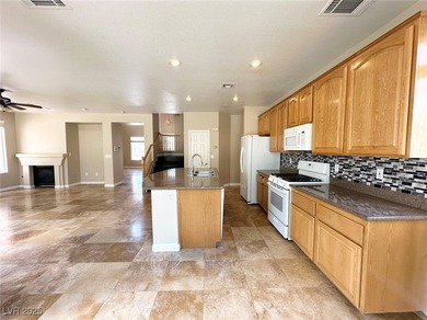 Golf course community, Guard gated. Vault ceiling, travertine on Rhodes Ranch Golf Club in Nevada - for sale on GolfHomes.com, golf home, golf lot