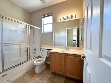 Golf course community, Guard gated. Vault ceiling, travertine on Rhodes Ranch Golf Club in Nevada - for sale on GolfHomes.com, golf home, golf lot