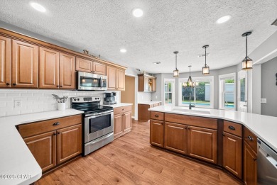 This spacious and beautifully updated 4-bedroom, 2.5-bath brick on Panama Country Club in Florida - for sale on GolfHomes.com, golf home, golf lot