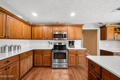 This spacious and beautifully updated 4-bedroom, 2.5-bath brick on Panama Country Club in Florida - for sale on GolfHomes.com, golf home, golf lot