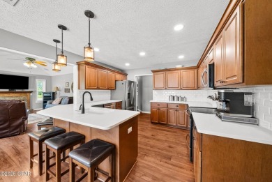 This spacious and beautifully updated 4-bedroom, 2.5-bath brick on Panama Country Club in Florida - for sale on GolfHomes.com, golf home, golf lot