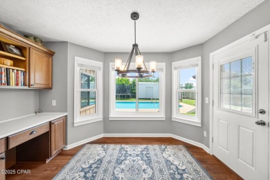 This spacious and beautifully updated 4-bedroom, 2.5-bath brick on Panama Country Club in Florida - for sale on GolfHomes.com, golf home, golf lot