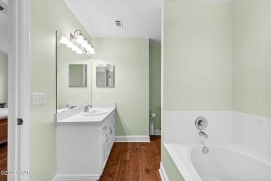 This spacious and beautifully updated 4-bedroom, 2.5-bath brick on Panama Country Club in Florida - for sale on GolfHomes.com, golf home, golf lot
