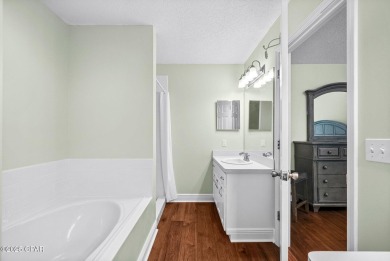 This spacious and beautifully updated 4-bedroom, 2.5-bath brick on Panama Country Club in Florida - for sale on GolfHomes.com, golf home, golf lot