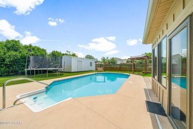This spacious and beautifully updated 4-bedroom, 2.5-bath brick on Panama Country Club in Florida - for sale on GolfHomes.com, golf home, golf lot