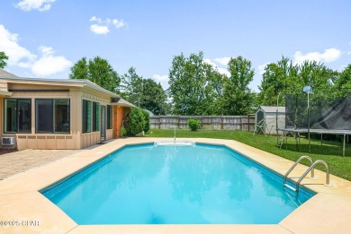 This spacious and beautifully updated 4-bedroom, 2.5-bath brick on Panama Country Club in Florida - for sale on GolfHomes.com, golf home, golf lot
