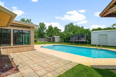 This spacious and beautifully updated 4-bedroom, 2.5-bath brick on Panama Country Club in Florida - for sale on GolfHomes.com, golf home, golf lot
