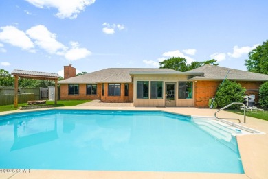 This spacious and beautifully updated 4-bedroom, 2.5-bath brick on Panama Country Club in Florida - for sale on GolfHomes.com, golf home, golf lot
