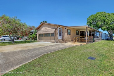 WELCOME TO THIS 2 BEDROOM 2 BATHROOM HOME IN LOVELY BAREFOOT on Barefoot Bay Golf Course in Florida - for sale on GolfHomes.com, golf home, golf lot
