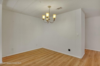 WELCOME TO THIS 2 BEDROOM 2 BATHROOM HOME IN LOVELY BAREFOOT on Barefoot Bay Golf Course in Florida - for sale on GolfHomes.com, golf home, golf lot