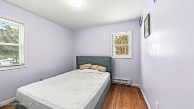 Located in a premier STR-friendly community, this home offers on Pocono Farms Country Club in Pennsylvania - for sale on GolfHomes.com, golf home, golf lot