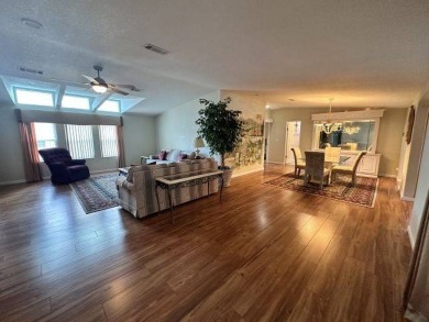 This beautiful triple-wide home, located on the golf course on Four Lakes Golf Club in Florida - for sale on GolfHomes.com, golf home, golf lot