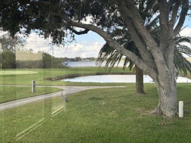 This beautiful triple-wide home, located on the golf course on Four Lakes Golf Club in Florida - for sale on GolfHomes.com, golf home, golf lot