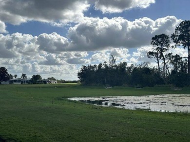 This beautiful triple-wide home, located on the golf course on Four Lakes Golf Club in Florida - for sale on GolfHomes.com, golf home, golf lot