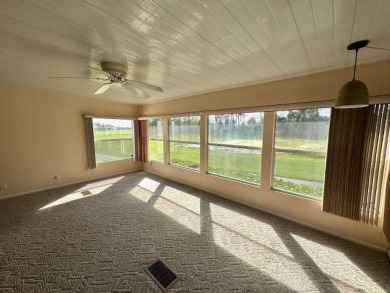 This beautiful triple-wide home, located on the golf course on Four Lakes Golf Club in Florida - for sale on GolfHomes.com, golf home, golf lot