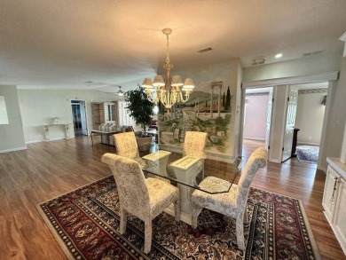 This beautiful triple-wide home, located on the golf course on Four Lakes Golf Club in Florida - for sale on GolfHomes.com, golf home, golf lot