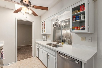 Enjoy comfortable and low-maintenance living in this delightful on Sun City Lakes West and East in Arizona - for sale on GolfHomes.com, golf home, golf lot