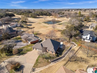 Step into this stunning 3-bedroom, 2-bath brick home perfectly on De Cordova Bend Country Club in Texas - for sale on GolfHomes.com, golf home, golf lot