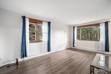 Welcome to your perfect mountain escape! This charming 2-bedroom on Estes Park Golf Course in Colorado - for sale on GolfHomes.com, golf home, golf lot