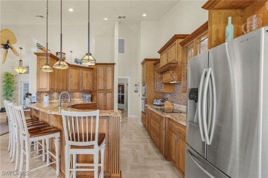 This home flows with charm, sunlight and lake views with privacy on Royal Tee Country Club in Florida - for sale on GolfHomes.com, golf home, golf lot