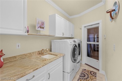 This home flows with charm, sunlight and lake views with privacy on Royal Tee Country Club in Florida - for sale on GolfHomes.com, golf home, golf lot