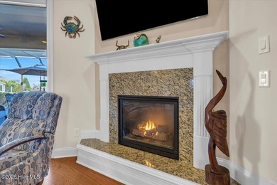 Experience the pinnacle of coastal living in this custom-built on Magnolia Greens Golf Plantation in North Carolina - for sale on GolfHomes.com, golf home, golf lot