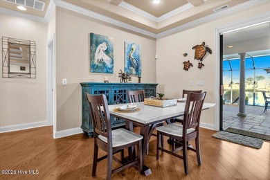 Experience the pinnacle of coastal living in this custom-built on Magnolia Greens Golf Plantation in North Carolina - for sale on GolfHomes.com, golf home, golf lot