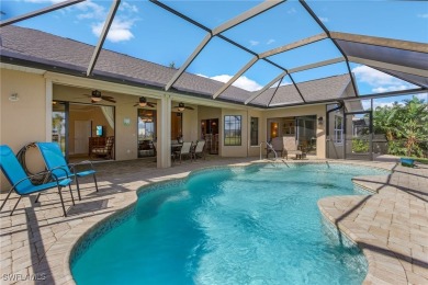This home flows with charm, sunlight and lake views with privacy on Royal Tee Country Club in Florida - for sale on GolfHomes.com, golf home, golf lot