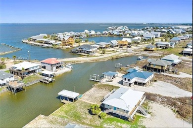 WATERFRONT ISLAND DREAM IN AN AMAZING LOCATION! Home has approx on Isle Dauphine Club Golf Course in Alabama - for sale on GolfHomes.com, golf home, golf lot
