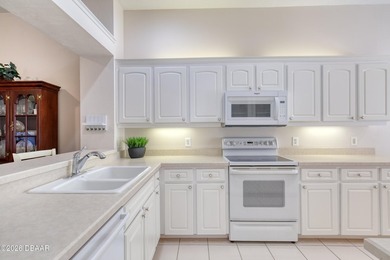 Located in the Halifax Plantation community, this 3-bedroom on Halifax Plantation Golf Club in Florida - for sale on GolfHomes.com, golf home, golf lot