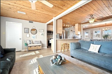 WATERFRONT ISLAND DREAM IN AN AMAZING LOCATION! Home has approx on Isle Dauphine Club Golf Course in Alabama - for sale on GolfHomes.com, golf home, golf lot