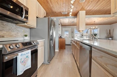 WATERFRONT ISLAND DREAM IN AN AMAZING LOCATION! Home has approx on Isle Dauphine Club Golf Course in Alabama - for sale on GolfHomes.com, golf home, golf lot