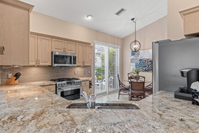Welcome to your dream home in award-winning University Park on University Park Country Club in Florida - for sale on GolfHomes.com, golf home, golf lot