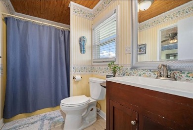 WATERFRONT ISLAND DREAM IN AN AMAZING LOCATION! Home has approx on Isle Dauphine Club Golf Course in AL - for sale on GolfHomes.com, golf home, golf lot