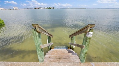 You'll be captivated the moment you step through the door of on Isla Del Sol Yacht and Country Club in Florida - for sale on GolfHomes.com, golf home, golf lot