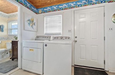 WATERFRONT ISLAND DREAM IN AN AMAZING LOCATION! Home has approx on Isle Dauphine Club Golf Course in AL - for sale on GolfHomes.com, golf home, golf lot