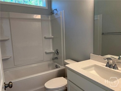 ***COUNTDOWN TO CLOSE-OUT***This newly constructed end-unit home on Savannah Quarters Country Club in Georgia - for sale on GolfHomes.com, golf home, golf lot