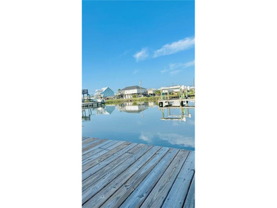 WATERFRONT ISLAND DREAM IN AN AMAZING LOCATION! Home has approx on Isle Dauphine Club Golf Course in AL - for sale on GolfHomes.com, golf home, golf lot