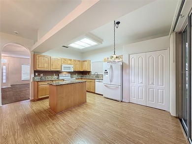 Home is a  St Andrews model located on a corner lot. A paver on Kings Ridge Golf Club in Florida - for sale on GolfHomes.com, golf home, golf lot