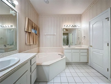 Home is a  St Andrews model located on a corner lot. A paver on Kings Ridge Golf Club in Florida - for sale on GolfHomes.com, golf home, golf lot