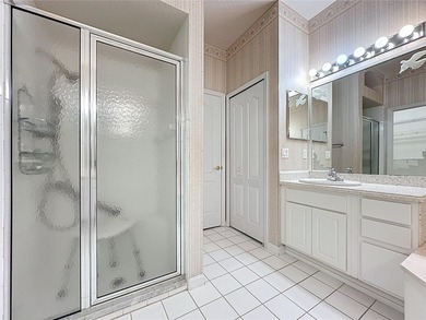 Home is a  St Andrews model located on a corner lot. A paver on Kings Ridge Golf Club in Florida - for sale on GolfHomes.com, golf home, golf lot