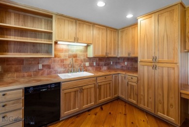 Situated along a quiet drive amongst quaking aspen groves and on Bridger Creek Golf Course in Montana - for sale on GolfHomes.com, golf home, golf lot