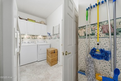 Coastal magnificence! This gorgeous brick home on nearly one on Sound Golf Links at Albemarle Plantation in North Carolina - for sale on GolfHomes.com, golf home, golf lot