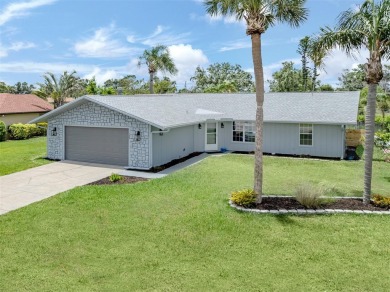 A newly renovated residence with a stunning water view is poised on Sarasota National Golf Club in Florida - for sale on GolfHomes.com, golf home, golf lot