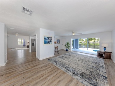 A newly renovated residence with a stunning water view is poised on Sarasota National Golf Club in Florida - for sale on GolfHomes.com, golf home, golf lot