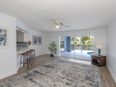 A newly renovated residence with a stunning water view is poised on Sarasota National Golf Club in Florida - for sale on GolfHomes.com, golf home, golf lot