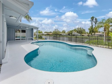A newly renovated residence with a stunning water view is poised on Sarasota National Golf Club in Florida - for sale on GolfHomes.com, golf home, golf lot