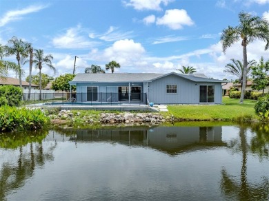 A newly renovated residence with a stunning water view is poised on Sarasota National Golf Club in Florida - for sale on GolfHomes.com, golf home, golf lot