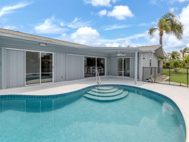 A newly renovated residence with a stunning water view is poised on Sarasota National Golf Club in Florida - for sale on GolfHomes.com, golf home, golf lot