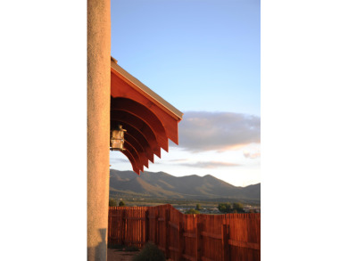 This is a remarkable custom home built in 2025 by renowned local on Taos Country Club in New Mexico - for sale on GolfHomes.com, golf home, golf lot